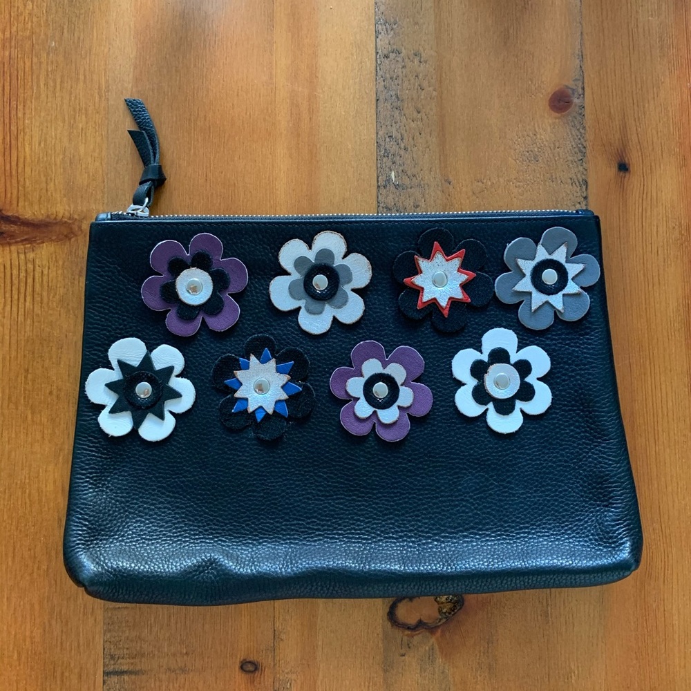 Leather clutch with 3D flower design